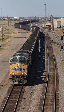 An eastbound train hauling coal from western strip mines passes through the Union Pacific Railroad's Bailey Yard, the largest rail yard in the world which handles 14, 000 rail cars every day, North Platte, Nebraska, USA