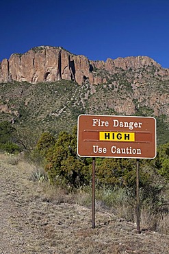 A sign warns of high danger of fire in the Chisos Mountains of Big Bend National Park, Big Bend National Park, Texas, USA