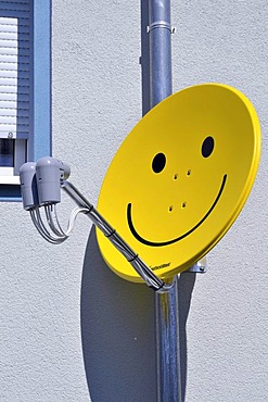 Satellite dish with smiley face, Germany, Europe