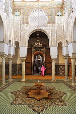 Partial view, interior with wash fountains, columns, stucco ornaments and tile mosaics in the Mausoleum of Moulay Ismail, Meknes, Morocco, Africa