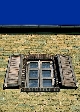 Wall of green sandstone with a window in Werl, Buederich district, North Rhine-Westphalia, Germany, Europe