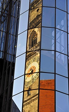 West tower of the Stiftskirche church reflected in modern glass front of a new building, Stuttgart, Baden-Wuerttemberg, Germany, Europe