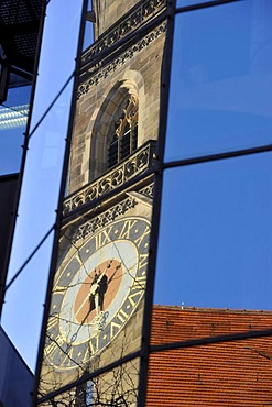 West tower of the Stiftskirche church reflected in modern glass front of a new building, Stuttgart, Baden-Wuerttemberg, Germany, Europe