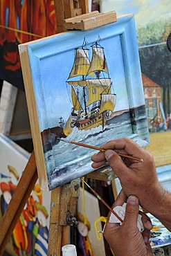 Artist painting a ship, Miedzyzdroje, Poland, Europe