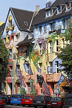 Kiefernstrasse street, houses of former squatters, artistically painted facades in street art style, Duesseldorf-Flingern, North Rhine-Westphalia, Germany, Europe