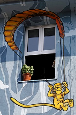 Monkey hanging from a parachute, window in artistically painted house, street art style, Kiefernstrasse, Duesseldorf-Flingern, North Rhine-Westphalia, Germany, Europe