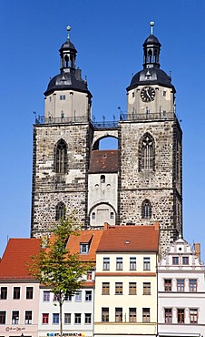 Towers of the church of St. Marien and restored houses in Lutherstadt Wittenberg, Saxony-Anhalt, Germany, Europe