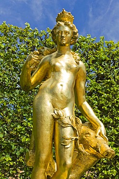 Golden statue of the hunting goddess Diana with boar's head, castle gardens, Schloss Schwetzingen castle, 18th century, Schwetzingen, Baden-Wuerttemberg, Germany, Europe