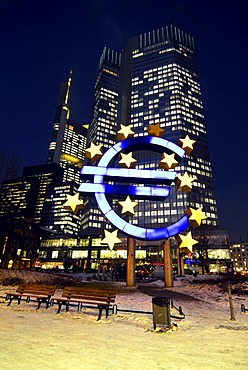 Euro sculpture, symbol of the European currency, ECB, European Central Bank in the evening, snowy Willy-Brandt-Platz square, Frankfurt am Main, Hesse, Germany, Europe