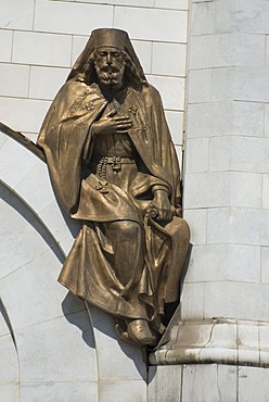 Bronze saint statue on the wall of the Christ the Saviour cathedral, Moscow, Russia