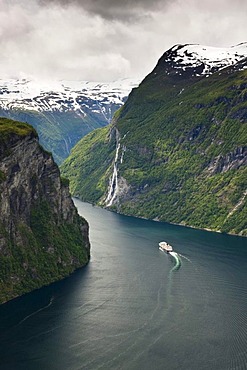 View of the Geiranger Fjord from the eagle eyes view ornesvingen with the waterfalls "The Seven Sisters" and a ship by Hurtigruten, Norway, Scandinavia, Europe