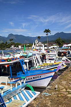 Chapel of Santa Rita and colourful boats in colonial town of Paraty, Costa Verde, State of Rio de Janeiro, Brazil, South America