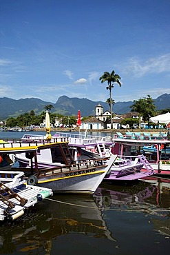 Colourful tourist boats in colonial town of Paraty, Costa Verde, State of Rio de Janeiro, Brazil, South America