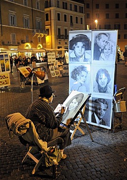 Street artist in the Piazza Navona square at night, Rome, Lazio, Italy, Europe