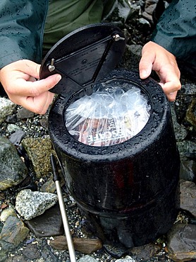 Bear canister, waterproof and bear safe packed equipment, Glacier Bay National Park, Alaska, USA