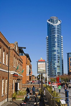 The Old Customs House Pub at the canalside with The Number One Tower, Lipstick, at back, Gunwharf Quays, Portsmouth, Hampshire, England, United Kingdom, Europe