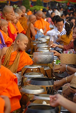 Theravada Buddhism, That Luang Festival, Tak Bat, monks standing behind alms bowls, hands, believers, pilgrims giving alms, orange robes, Vientiane, Laos, Southeast Asia, Asia