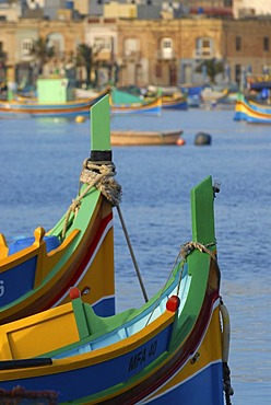 Details of luzzus, the typical colorful fishing boats of Malta, in Marsaxlokk Harbour, Malta, Europe