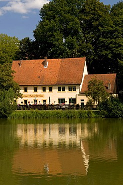 Schlossbraeu restaurant reflected in a pond, Thurnau, Franconian Switzerland, Franconia, Bavaria, Germany, Europe