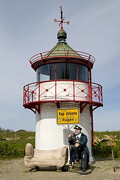 Seaman figure with a town name sign in front of the lighthouse at Cape Arkona, Isle of Ruegen, Mecklenburg-Western Pomerania, Germany, Europe