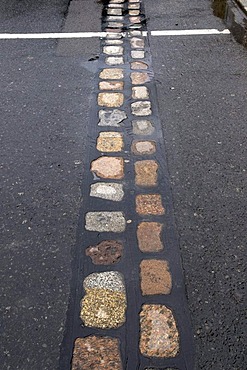 Cobble stones in the street marking the former course of the Berlin Wall, Berlin, Germany, Europe