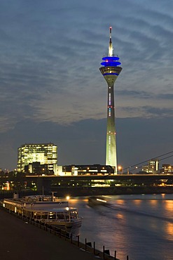 City gate and Rheinturm tower at dusk, state capitol Duesseldorf, North Rhine-Westphalia, Germany, Europe