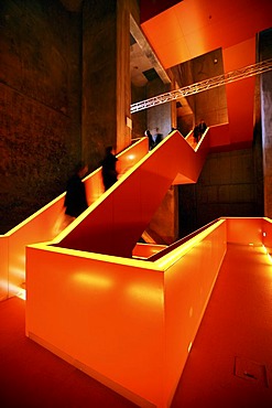 Red illuminated main staircase in the new Ruhrmuseum museum, opened in January 2010, Capital of Culture year, in the former coal washing plant of the Zeche Zollverein mine, World Heritage Site, Essen, North Rhine-Westphalia, Germany, Europe