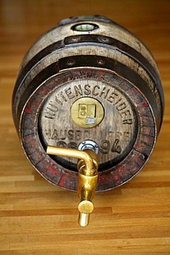 Wood beer keg in a small private brewery, with brass tap