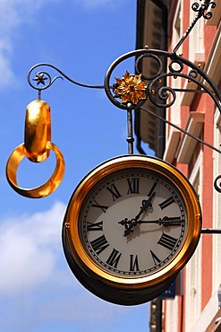 Large clock and two gold wedding rings as a sign outside a jewellery store, Freiburg im Breisgau, Baden-Wuerttemberg, Germany, Europe