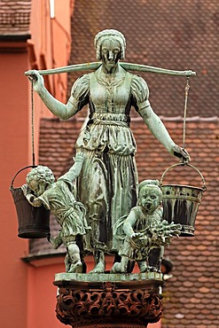 Water carrier with children as figures on the fountain, donated in 1911 by the merchant Ludwig Rau, Kartoffelmarkt square, Freiburg, Baden-Wuerttemberg, Germany, Europe