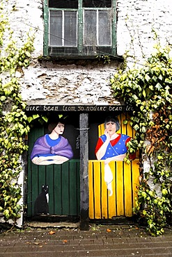 Painting of two women on wooden doors, Killarney, Ireland, Europe