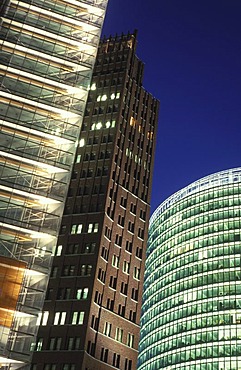 Illuminated high-rise office buildings on Potsdamer Platz at dusk, Berlin, Germany, Europe