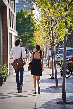 Young couple walking down the street, spring