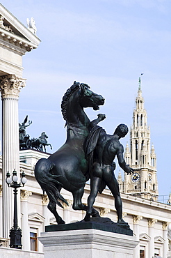 Austrian Parliament Building on the Vienna ring road with the statue of The Horse Tamer in front of the tower of City Hall, Vienna, Austria, Europe