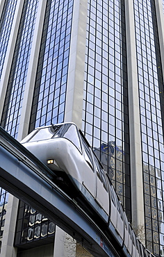 Monorail passing a high-rise building, Central Business District, Sydney, New South Wales, Australia