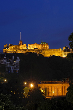 Edinburgh Castle at dusk from Princes Street, Edinburgh, Scotland, United Kingdom, Europe