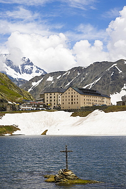 View of Hospice du Grand-Saint-Bernard across the lake, Great St Bernard Pass, Col du Grand-Saint-Bernard, Colle del Gran San Bernardo, Western Alps, Italy, Europe