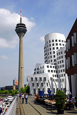 Rheinturm tower and Neuer Zollhof, Arts and Media Centre Rheinhafen, building by the architect Frank O. Gehry, Gehry buildings at the Handelshafen, Medienhafen, Rheinhafen, Duesseldorf, North Rhine-Westphalia, Germany, Europe