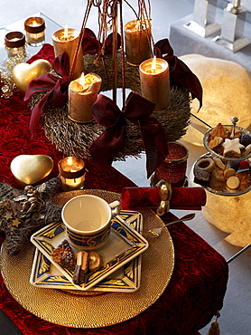 Christmas wreath above a ready laid coffee table