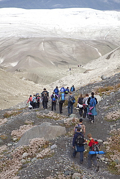 People hike towards Root Glacier in Wrangell-St. Elias National Park, where they will learn ice climbing, Kennicott, Alaska, USA