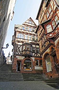 Second hand bookshop, shop for antique books, Steile Strasse street, stairs, historic half-timbered houses, historic centre, Marburg, Hesse, Germany, Europe