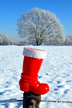 Red boot from Santa Claus in snowscape