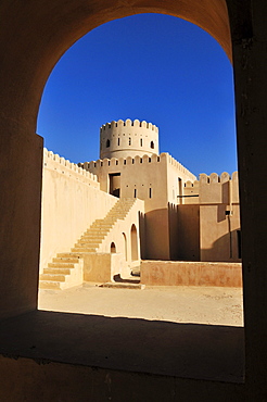 Historic adobe fortification, watchtower of Sunaysilah Castle or Fort in Sur, Al Sharqiya Region, Sultanate of Oman, Arabia, Middle East