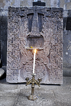 Candleholder and historic cross-stone, khachkar in the Armenian Orthodox church of St. Hripsime, UNESCO World Heritage Site, Echmiadzin, Armenia, Asia