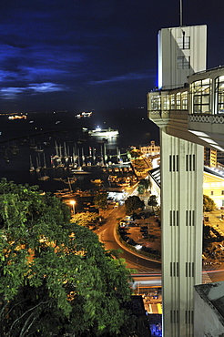 View of the lower city Cidade Baixa and lift Elevador Lacerda at night, Salvador, Bahia, UNESCO World Heritage Site, Brazil, South America