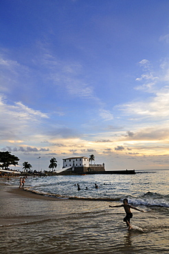 Sunset on the beach of Porto da Barra and Forte Santa Maria fortress, Salvador, Bahia, Brazil, South America