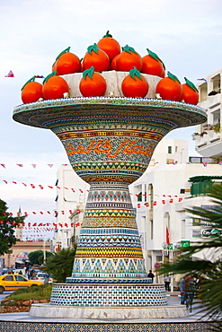 Artificial fruit bowl with oranges, street monument, mosaic, Hammamet, Tunisia, Northern Africa