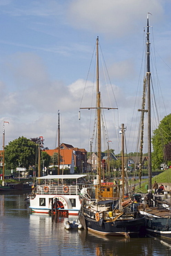 Carolinensiel, paddle steamer Concordia II at the pier in the museum harbor, in the front two historic sailing ships, Wittmund, Nationalpark Wattenmeer, Wadden Sea National Park, East Frisia, Lower Saxony, Germany, Europe