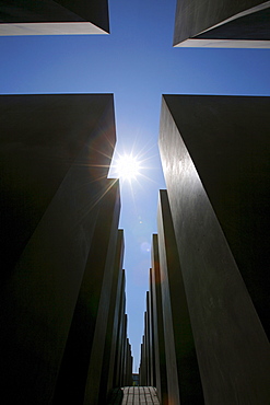 Sun over the concrete slabs or stelae at the Memorial to the Murdered Jews of Europe, Berlin, Germany, Europe