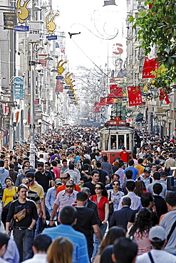 Historic tram driving through the crowd, shopping street Istiklal Caddesi, Independence Street, Beyoglu, Istanbul, Turkey